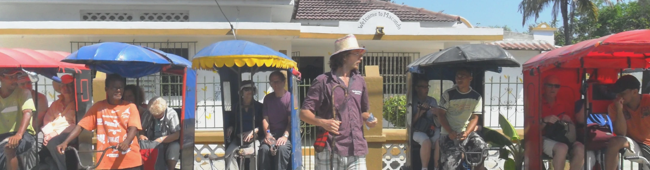 Tim Buendía outside The Gypsy Residence with Aracataca’s bicycle taxi drivers